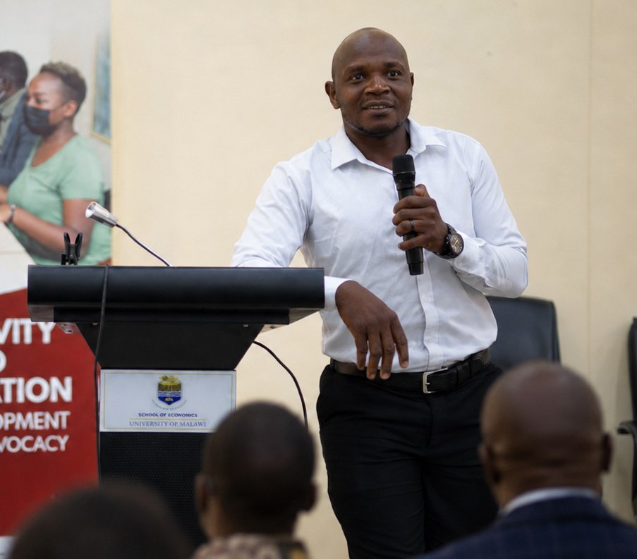 P. Kay speaking on stage